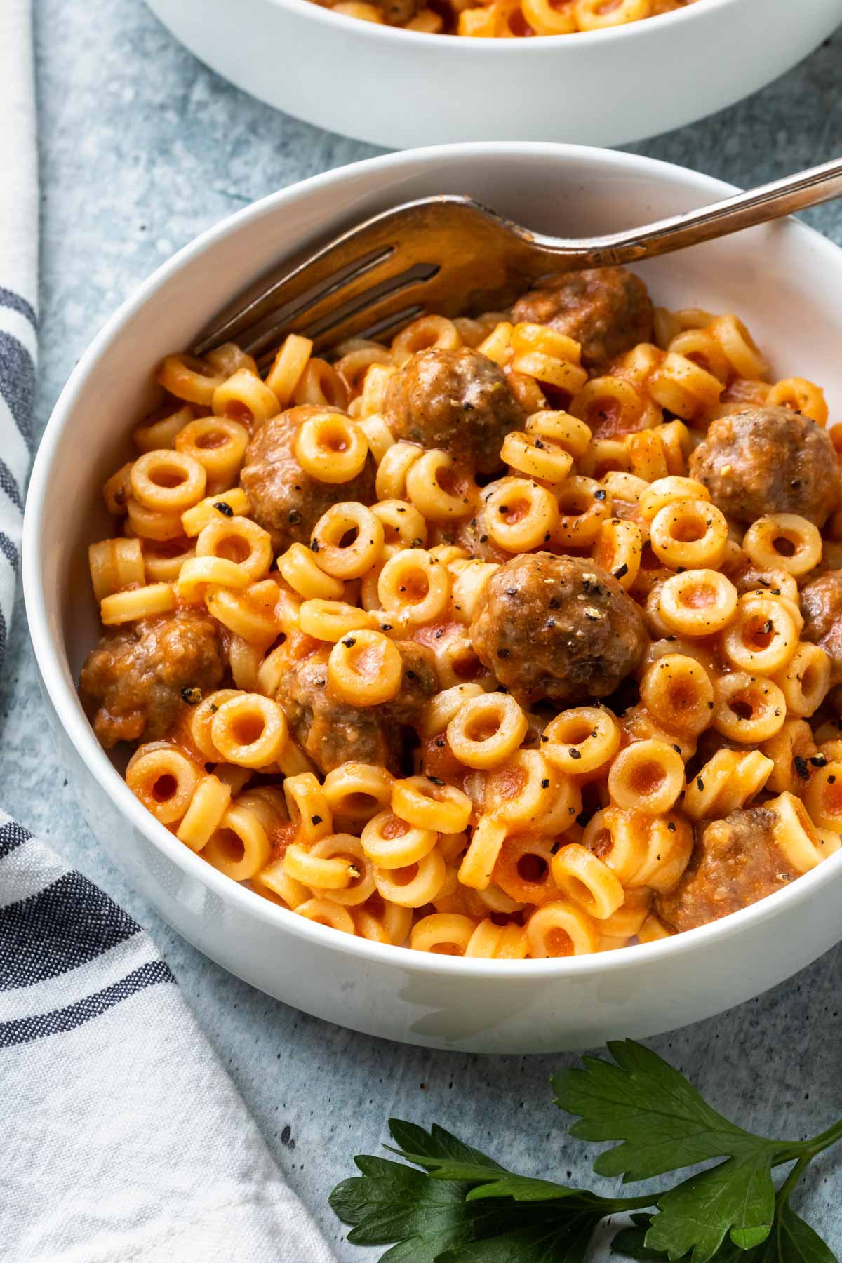 pasta rings with mini meatballs in a bowl