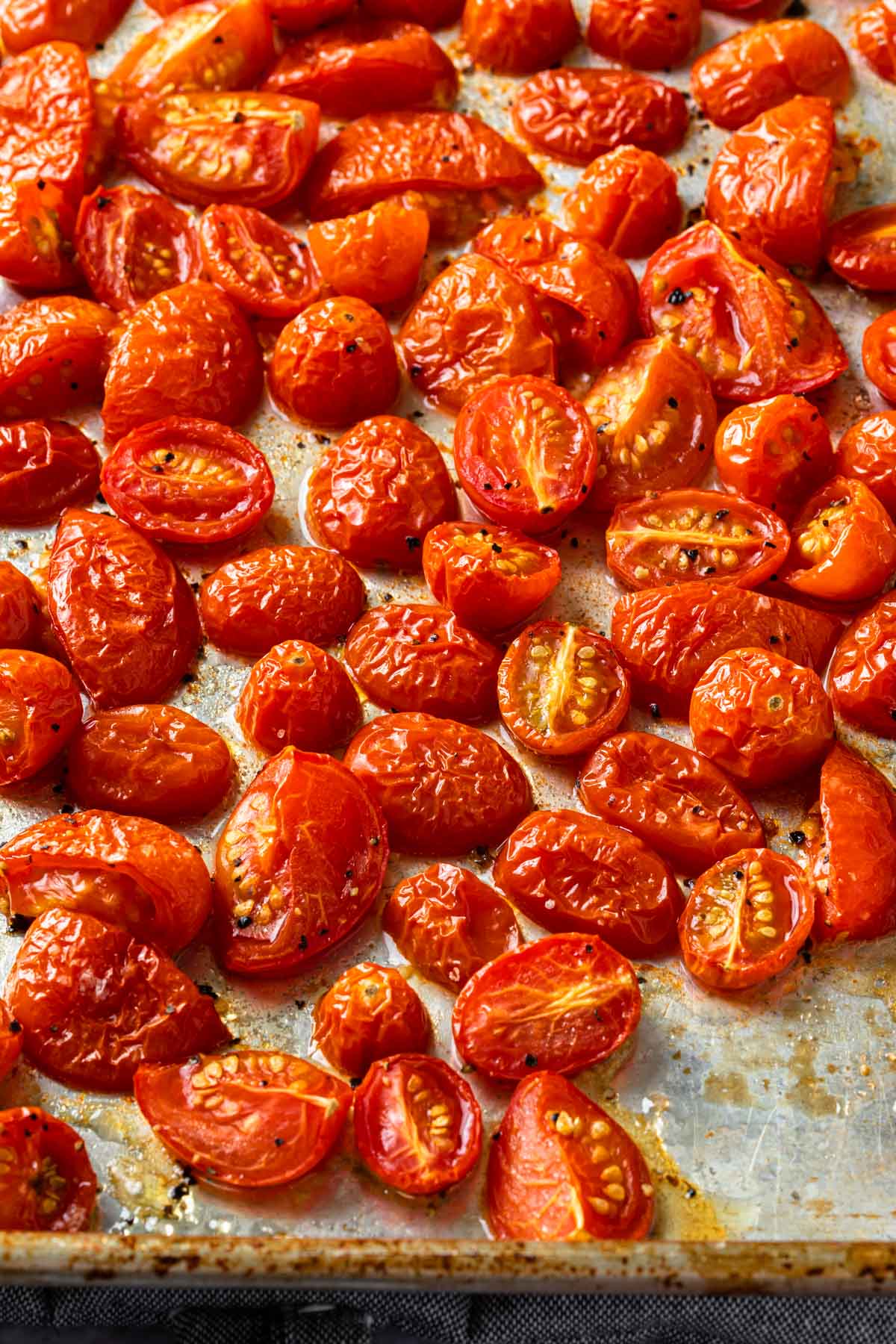 A baking sheet with roasted cherry and grape tomatoes. 
