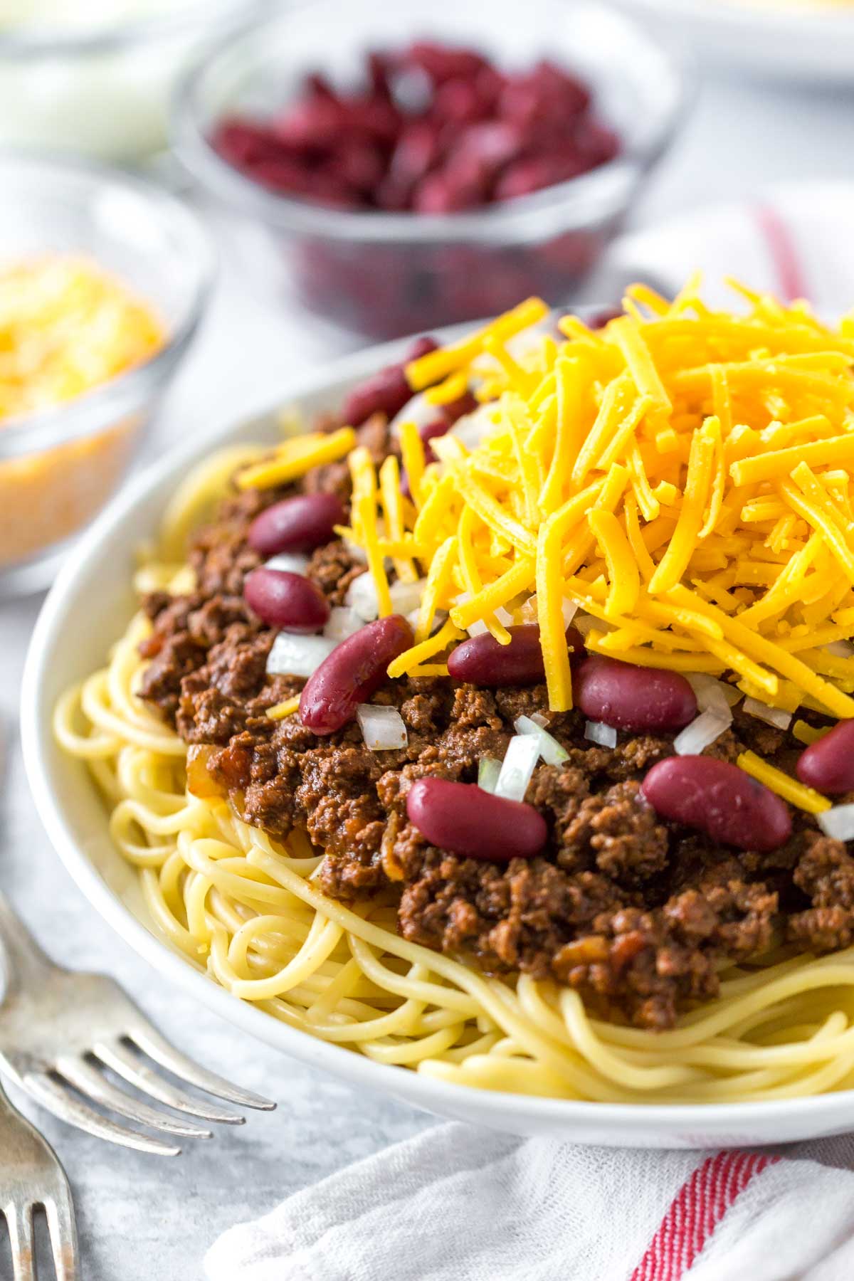 close up of chili spaghetti in a white bowl