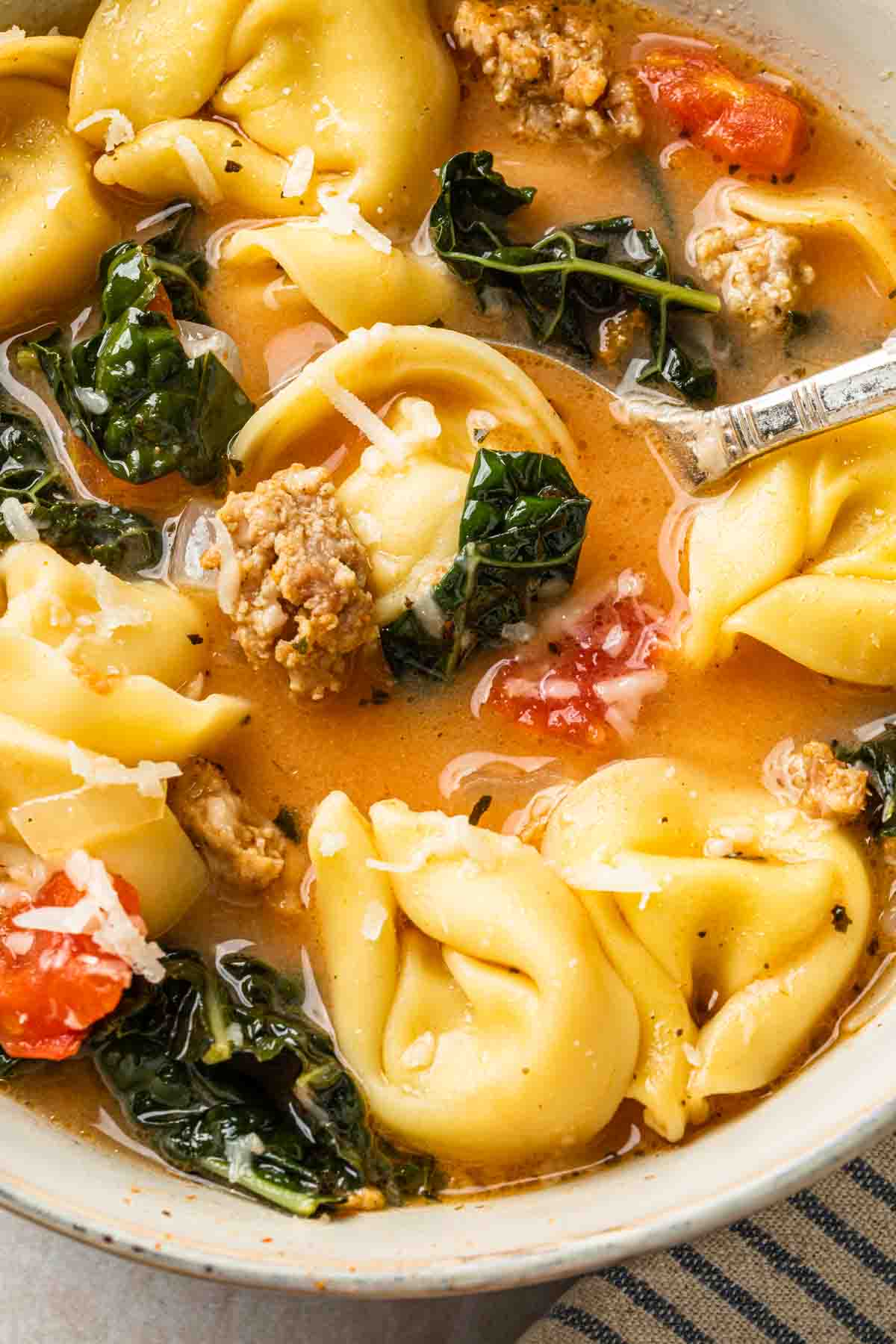 Close up of tortellini soup.