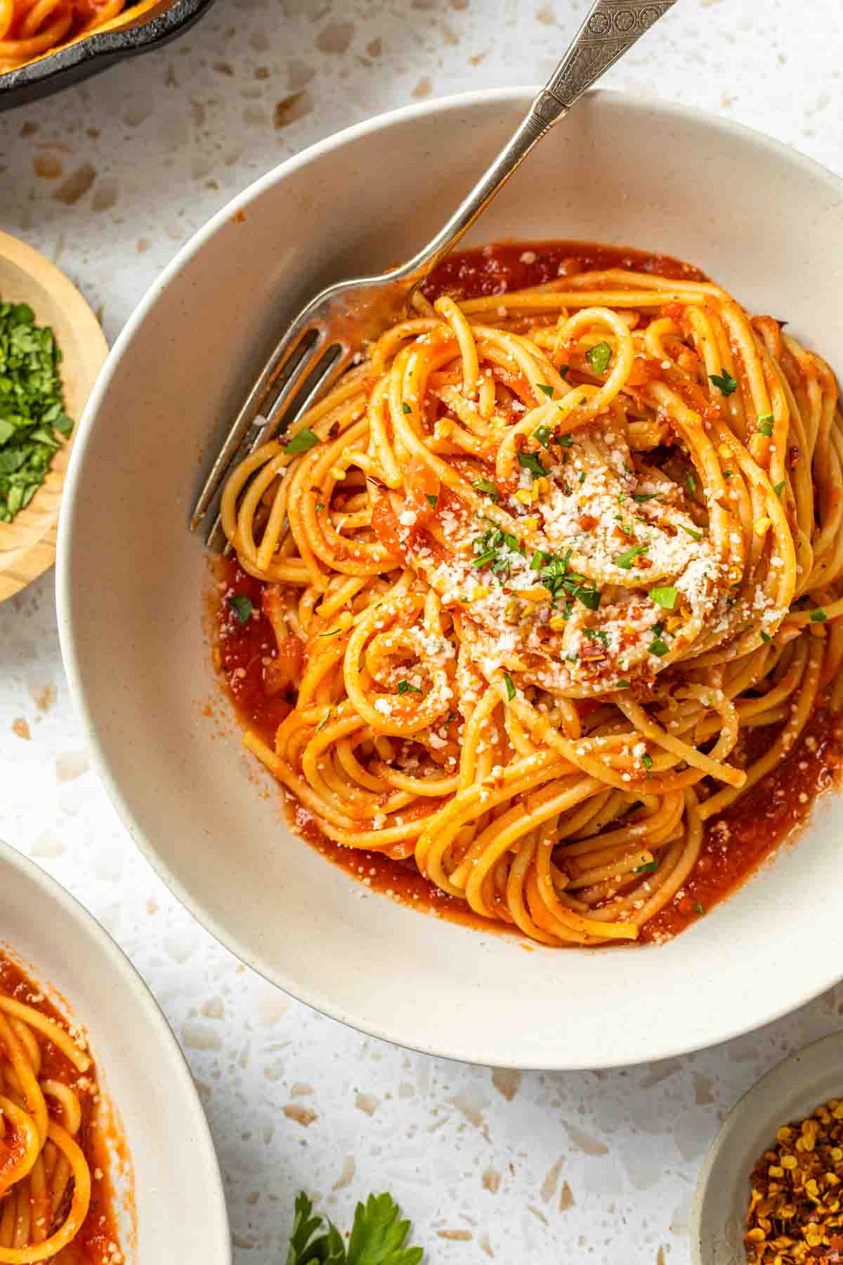 Close up of a bowl of pasta with arrabiata sauce. 