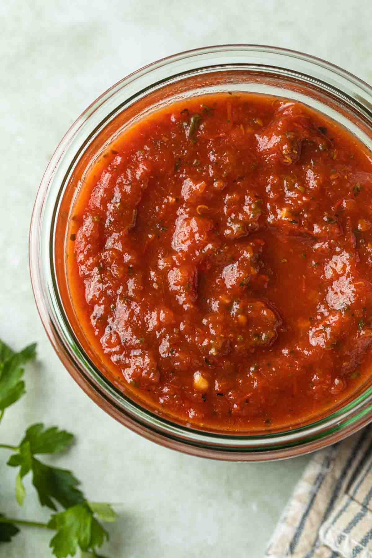 Overhead shot of a jar of homemade spaghetti sauce. 