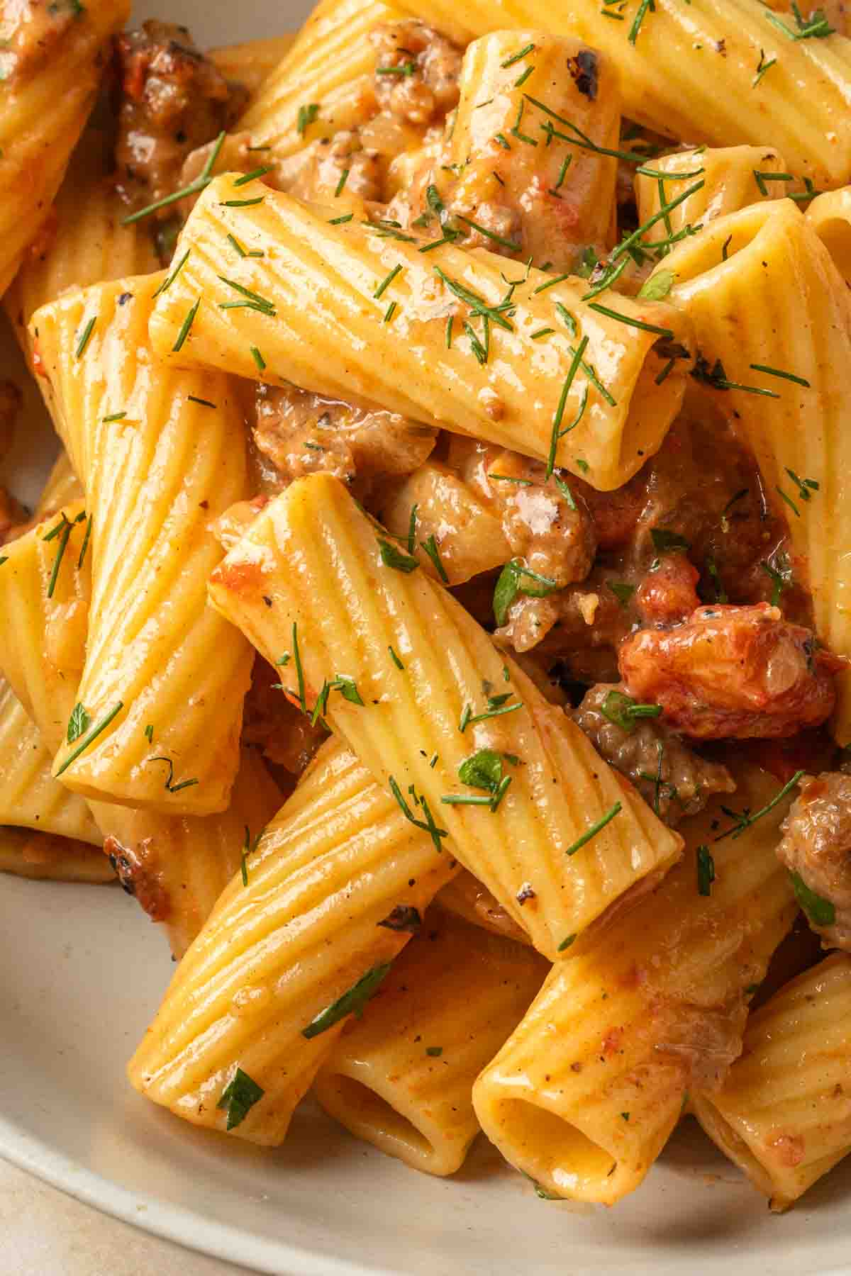 Close up of rigatoni with an sweet sausage tomato sauce. 